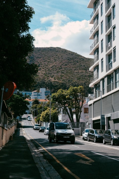 a street with cars and buildings on the side