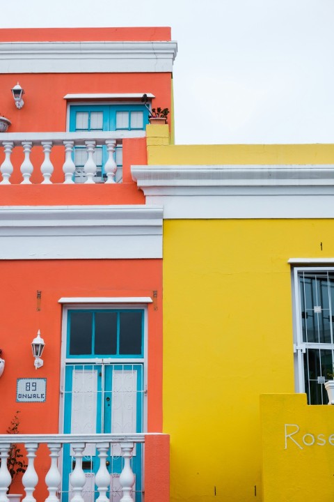 a yellow building with blue doors