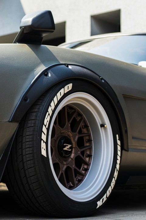 a close up of a car tire on a street