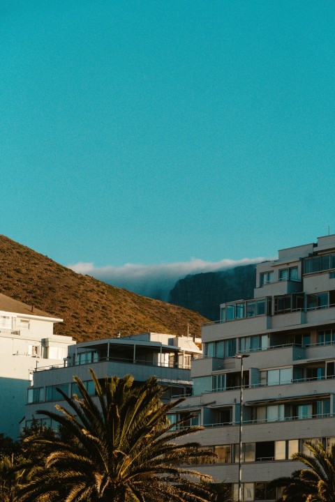 a view of a building with a mountain in the background