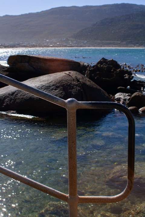 a wooden railing over water