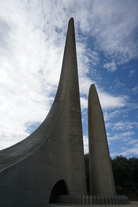 a couple of very tall towers sitting next to each other