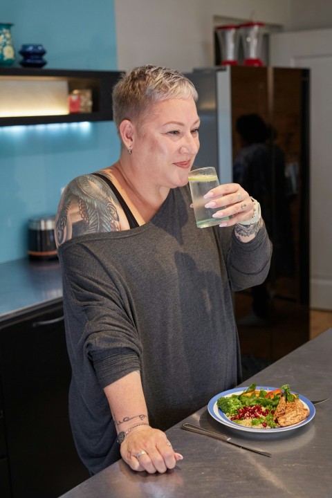 a person enjoying a glass of water