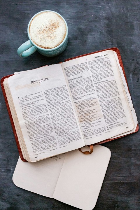 white book page on brown wooden table