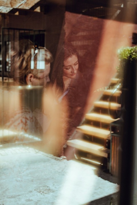 a woman sitting in a hot tub next to a man