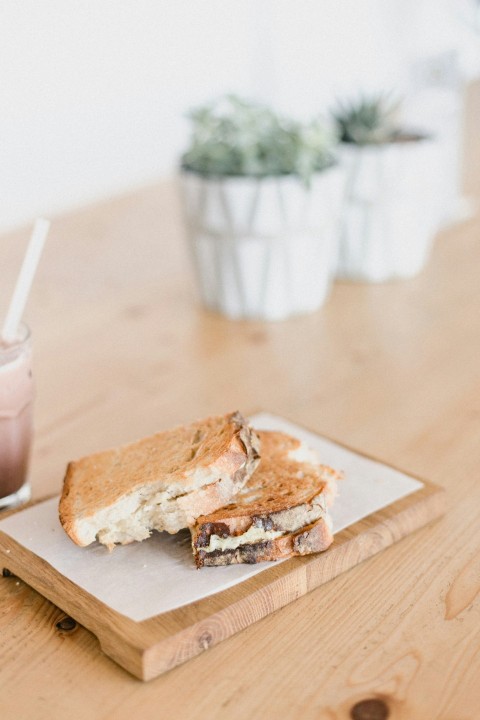 sliced bread on brown wooden chopping board