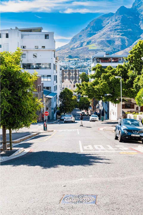 a city street with cars parked on both sides