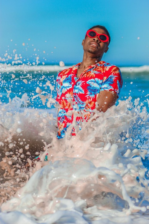 woman in blue and red floral swimsuit wearing blue goggles