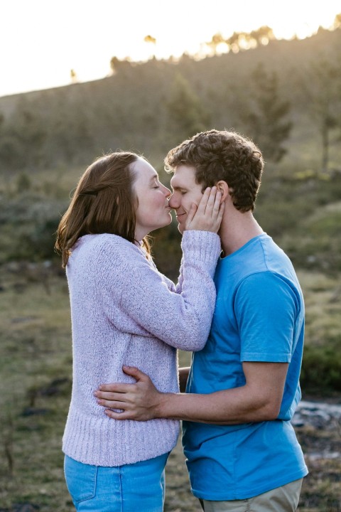 man and woman kissing each other