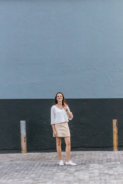 woman standing in front of gray and black painted wall CgwF