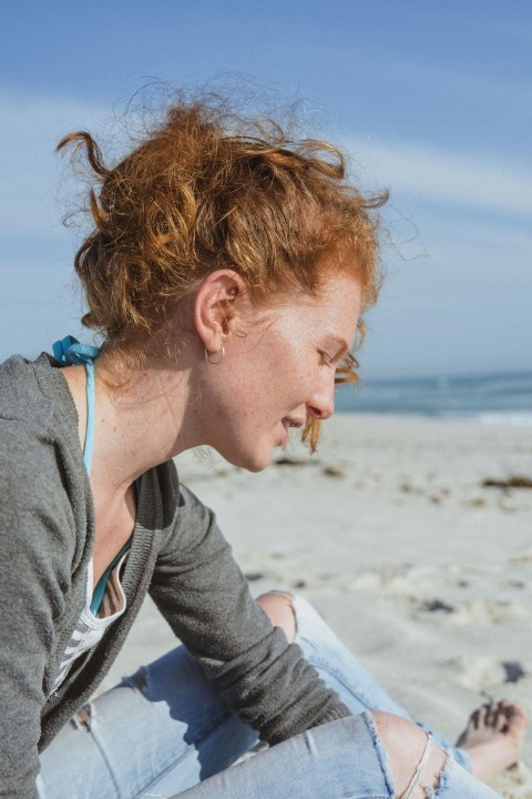 woman sitting on coast