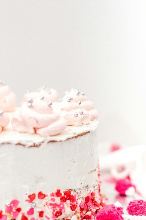 pink rose petals on white cake xN