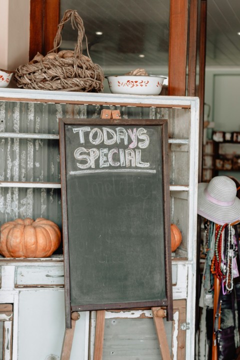 green chalkboard with brown frame