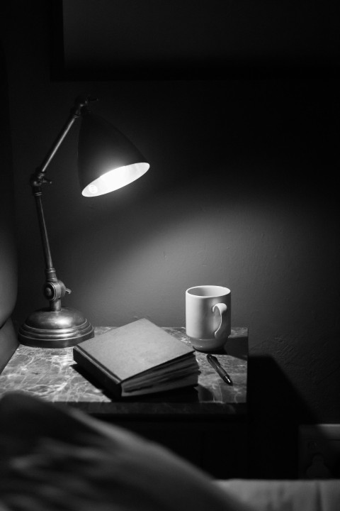 white ceramic mug on brown wooden table r0KP1Ua9