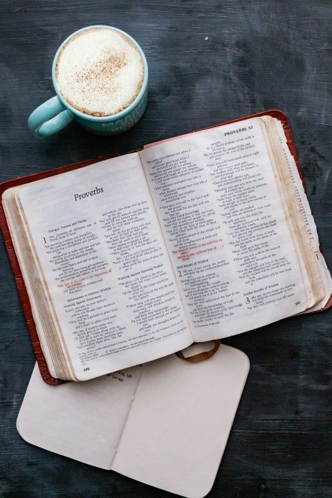 white book page on brown wooden table