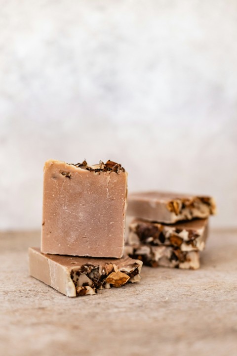 a close up of a bar of soap on a table NRYHO