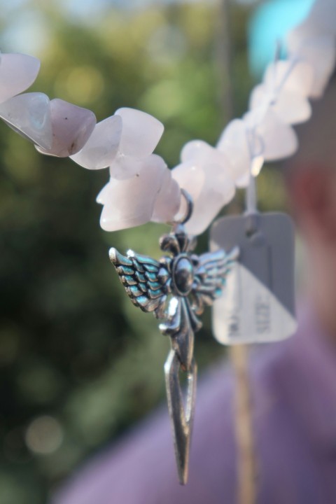 a close up of a necklace on a stick