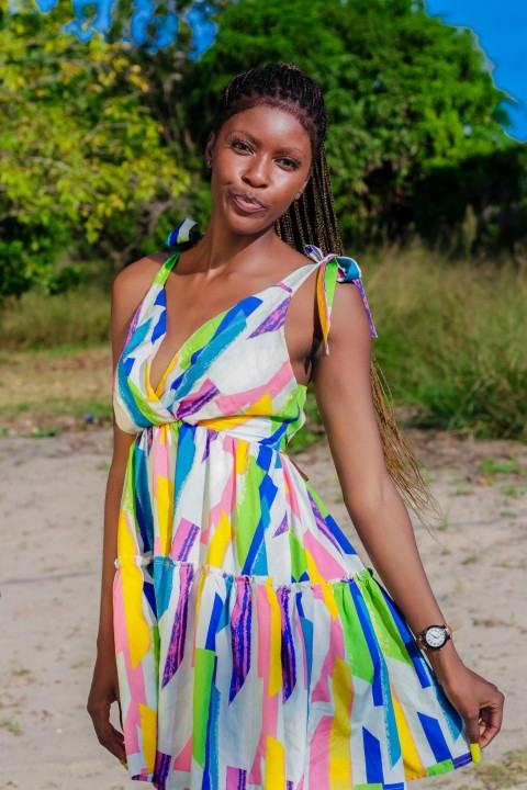 a woman in a colorful dress posing for a picture KMSKu5