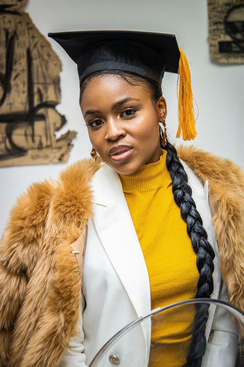 a person wearing a graduation gown