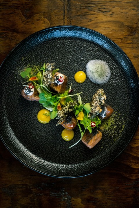 a plate of food on a wooden table