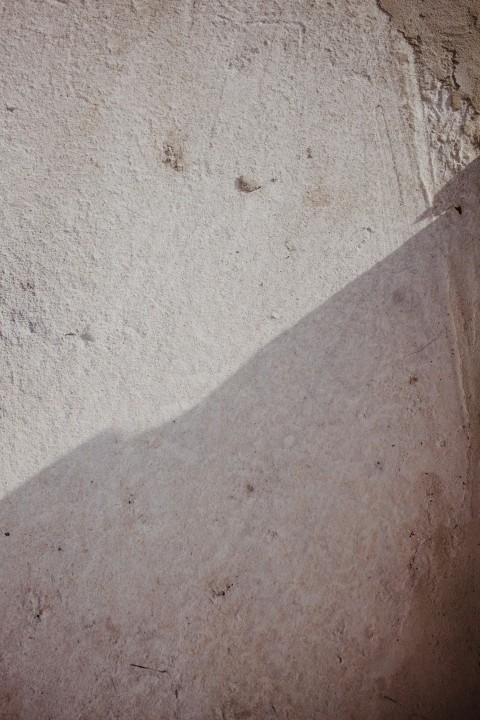 person standing on gray sand