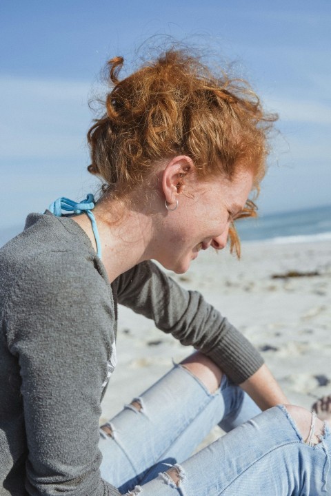 woman wearing black sweatshirt while smiling