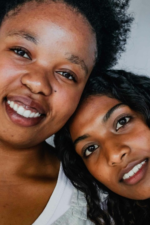 a couple of women standing next to each other