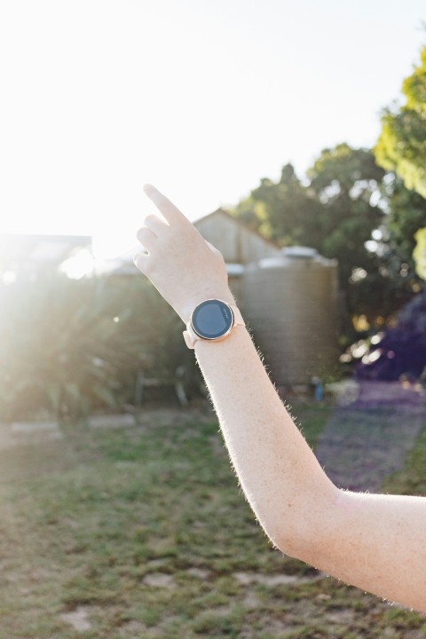 person wearing blue and silver watch mxJI