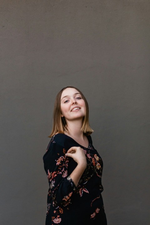 woman in black and white floral dress