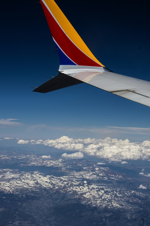 a view of the wing of an airplane in the sky