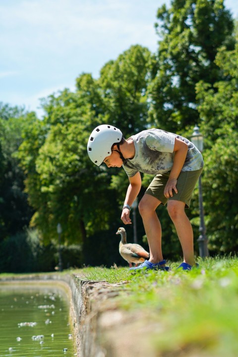 a man with a skateboard and a duck