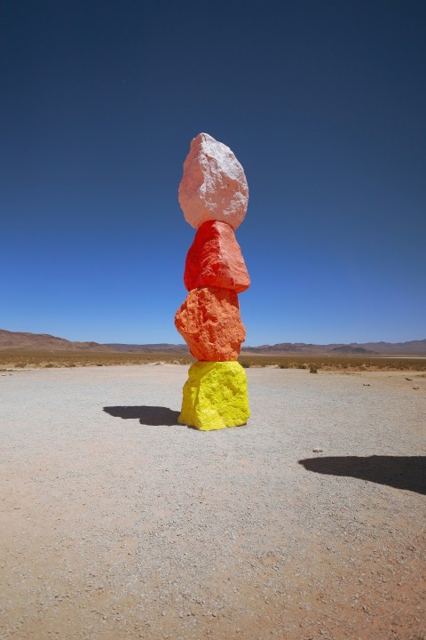 a stack of rocks in the middle of a desert