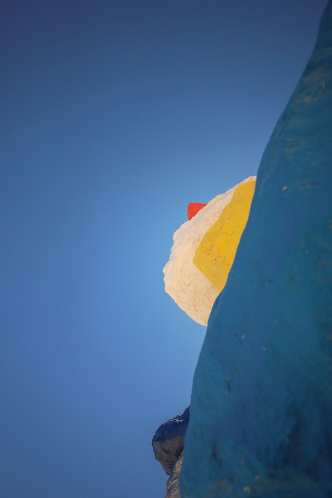 a beach umbrella with a blue sky in the background