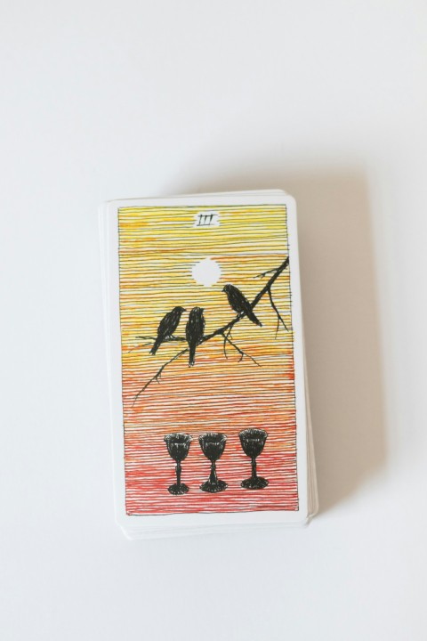 a deck of playing cards with birds on a branch