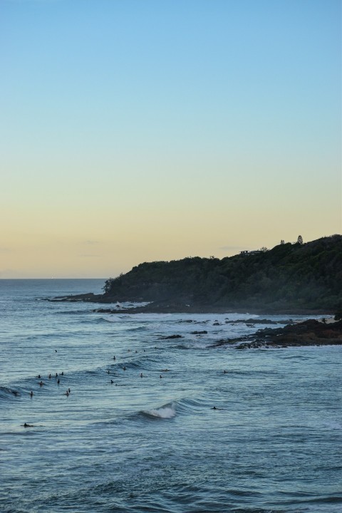 a body of water with waves coming in to shore