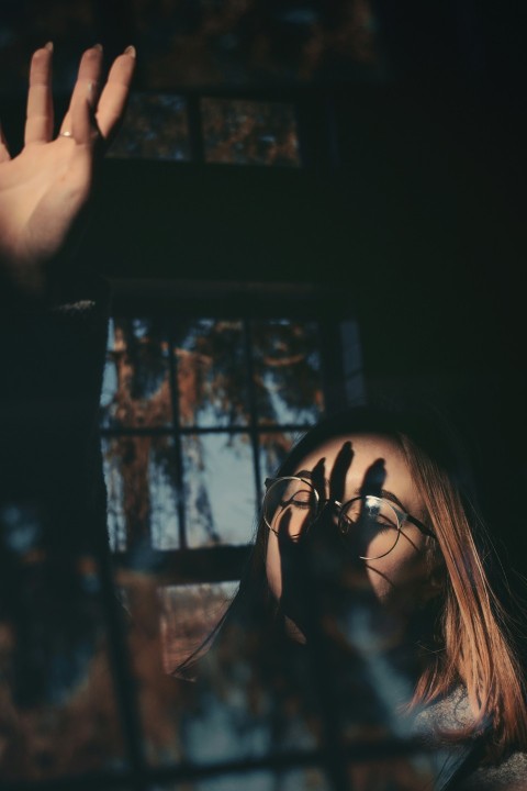 a woman with her hands up in the air