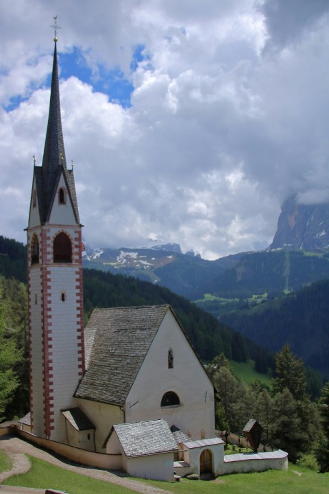 a church in the middle of a mountain range