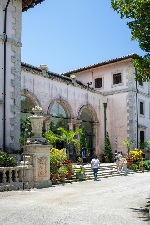 a couple of people that are standing in front of a building