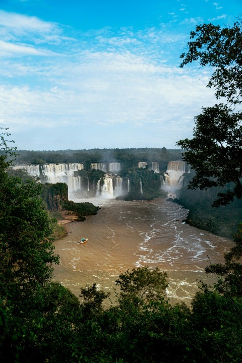 a view of a river with a waterfall in the background KSV