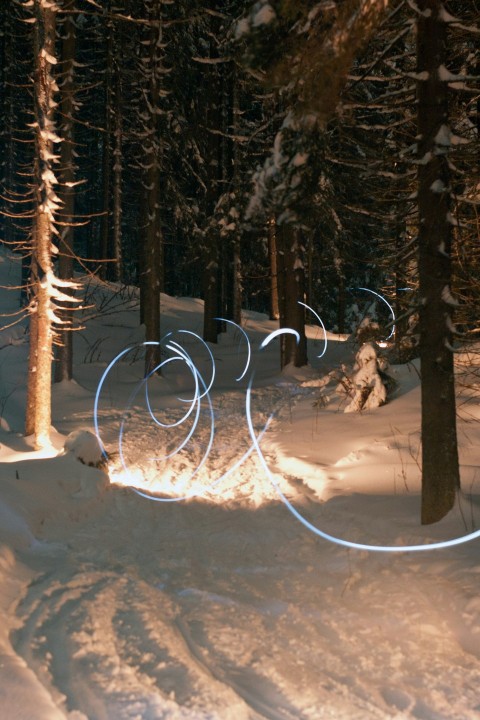 a person riding skis on a snowy surface