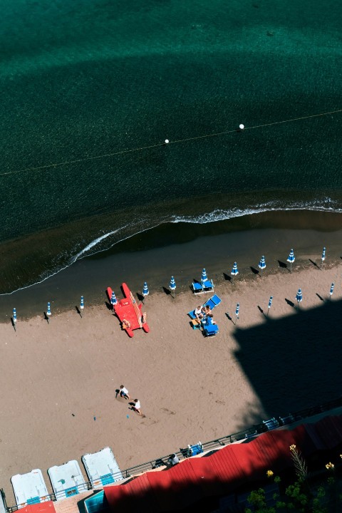 a group of people sitting at a beach