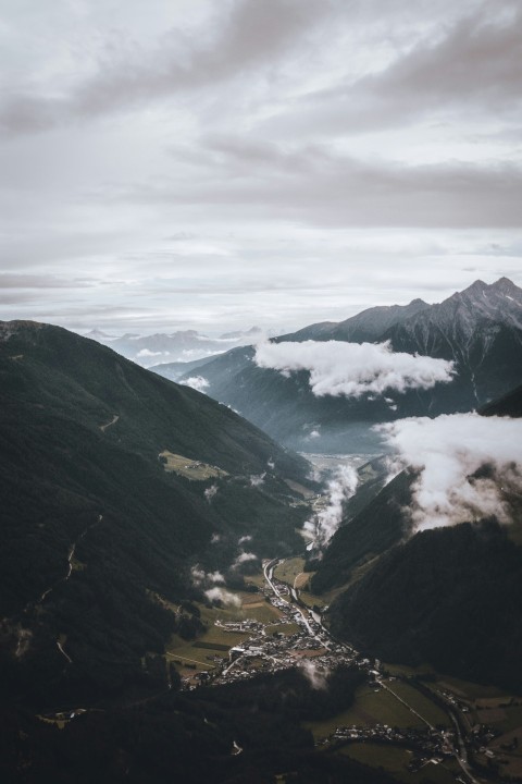 birds eye view of city surrounded by mountains