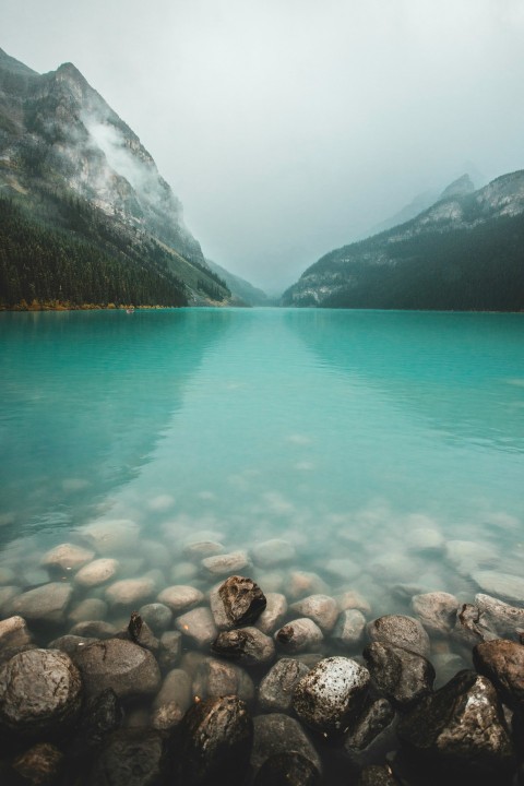 a body of water with a mountain in the background