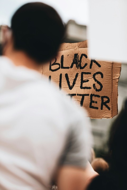 man holding a black lives matter sign