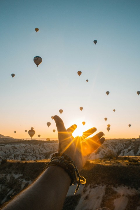 left human hand with air balloons background 55