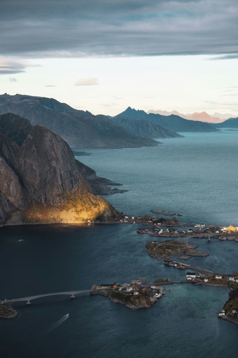 aerial view of body of water near mountain during daytime DkTkTaP