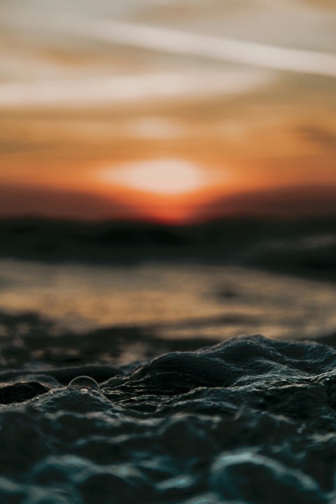 black sand during orange sunset