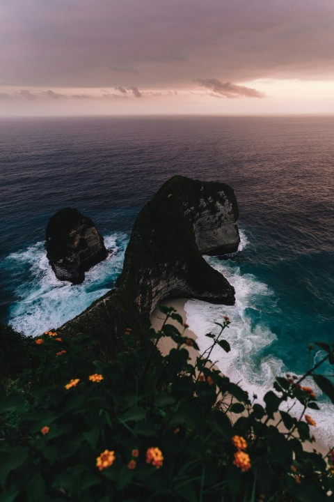 rocky beach cliff viewing calm sea