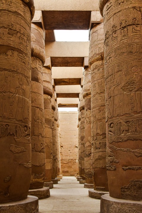 the inside of an egyptian temple with columns w0TajV2