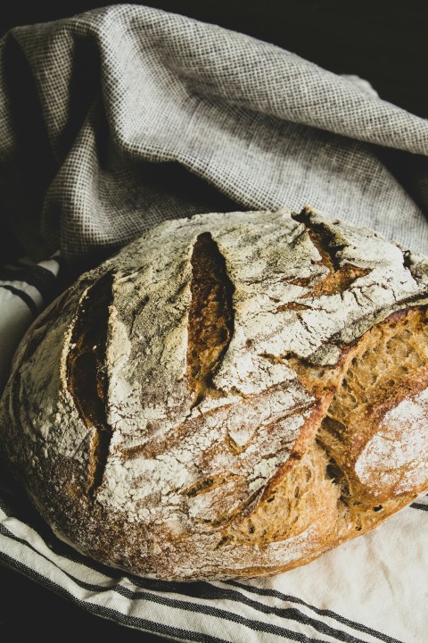 brown bread on white and black textile